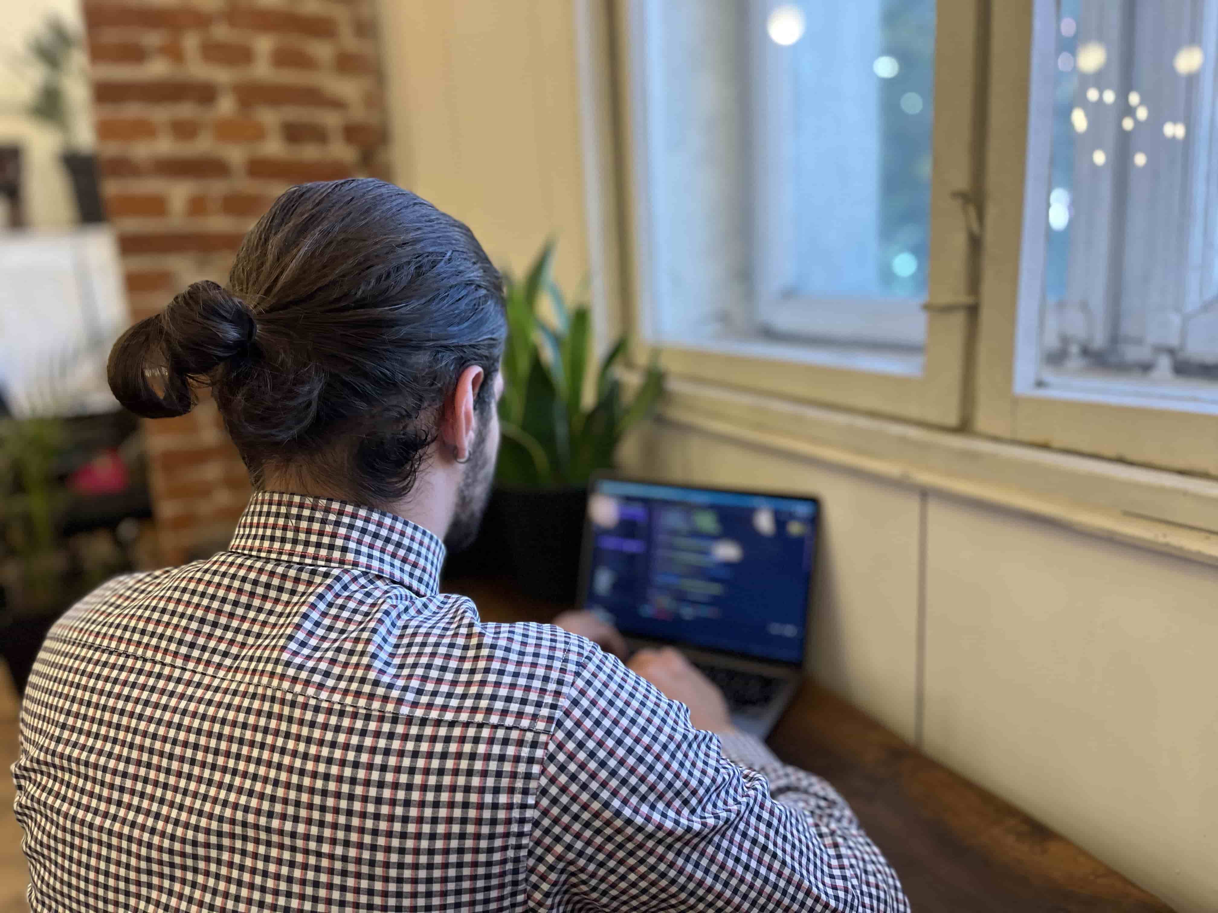 Men coding on a computer